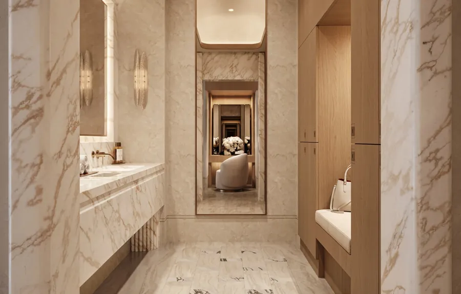 Marble spa suite with vanity and treatment room beyond